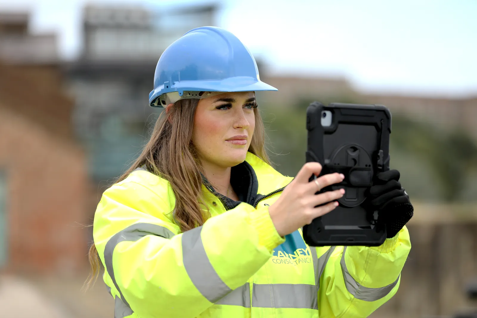 A Carney consultant recording a site inspection on a tablet